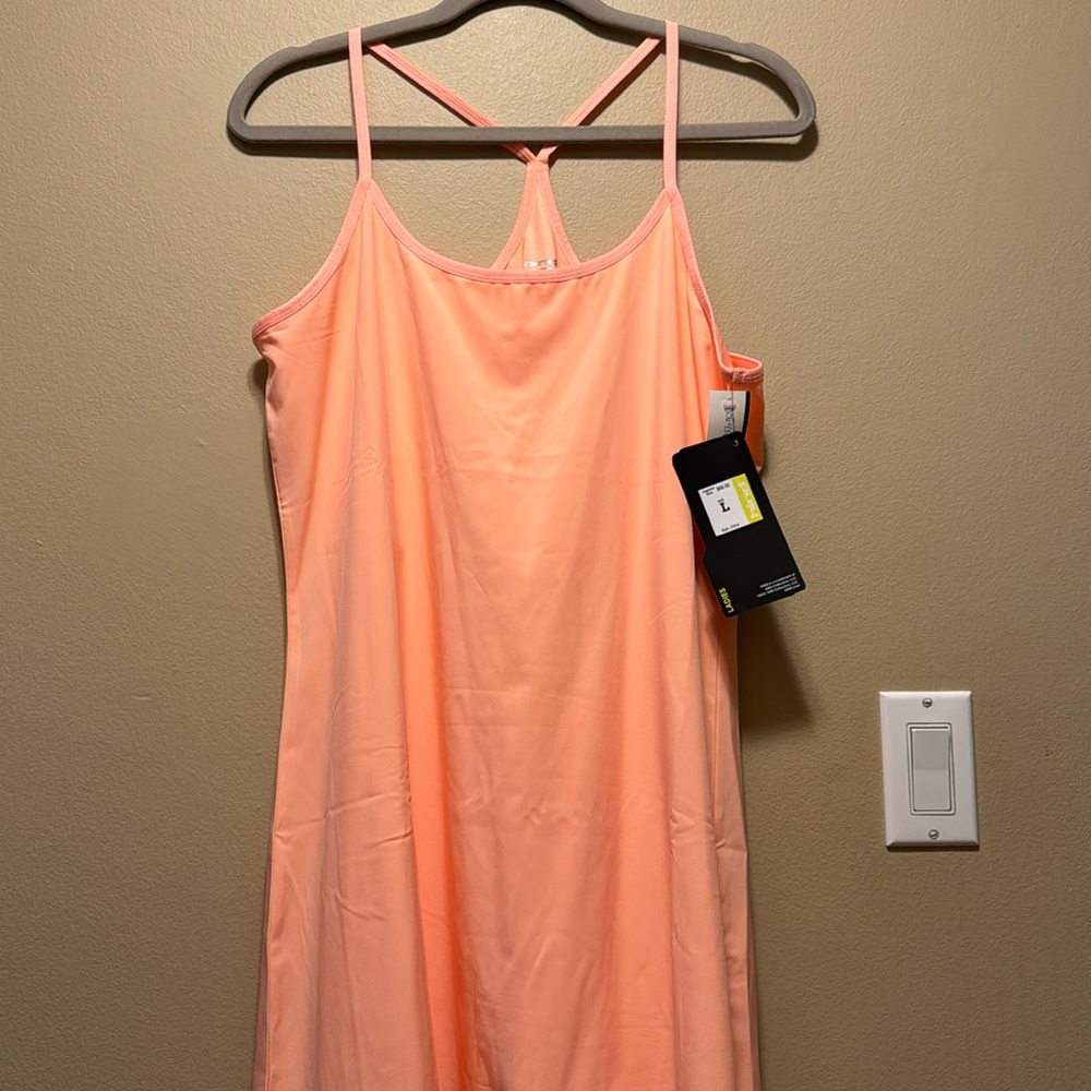 Orange colored sport dress with shorts